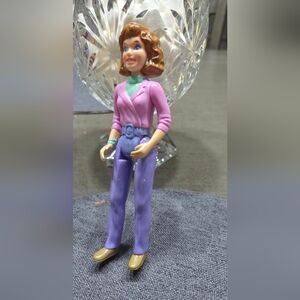 Stylish Action Figure with Purple Outfit